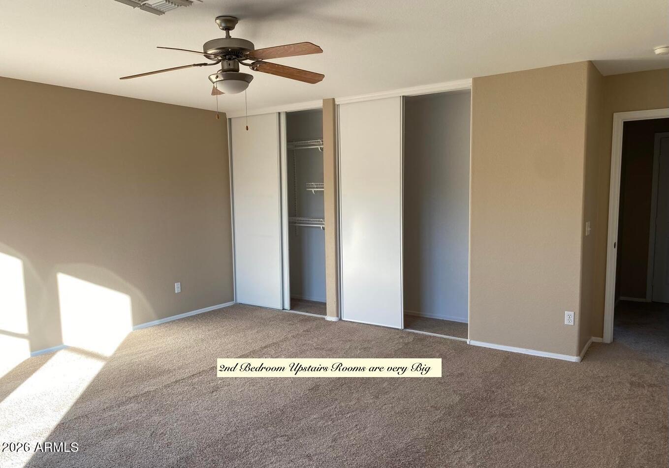 3427 East Derringer Way Gilbert, AZ 85297 - Photo 14 of 23 a view of a livingroom with a ceiling fan and window