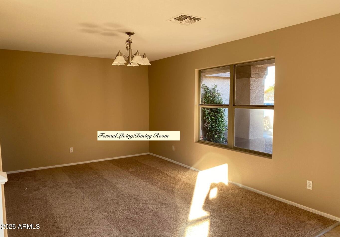 3427 East Derringer Way Gilbert, AZ 85297 - Photo 2 of 23 a view of an empty room with a window