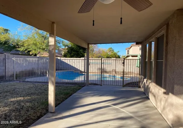 a view of a backyard with a floor to ceiling window
