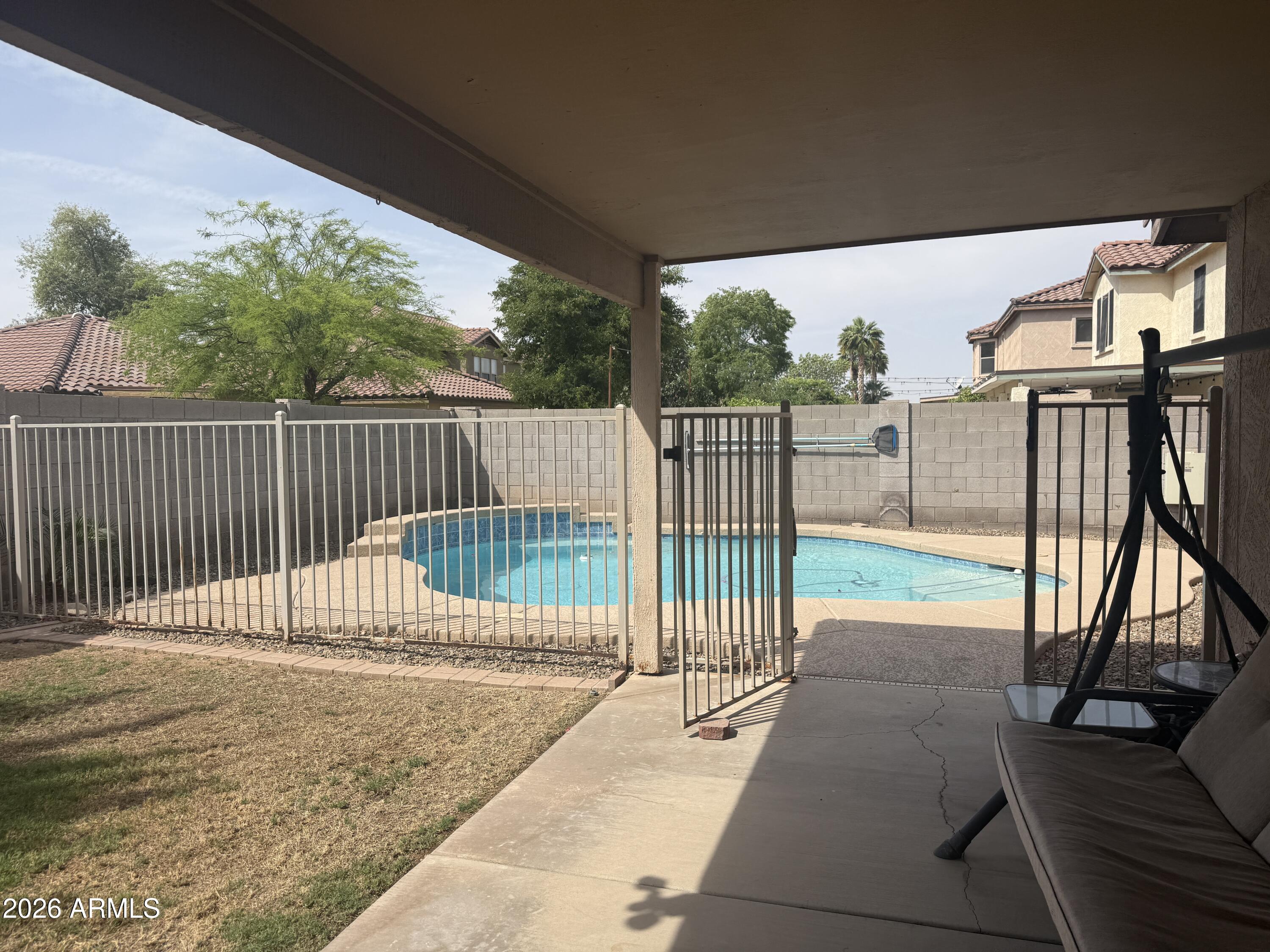 3427 East Derringer Way Gilbert, AZ 85297 - Photo 23 of 23 a view of a backyard with a floor to ceiling window