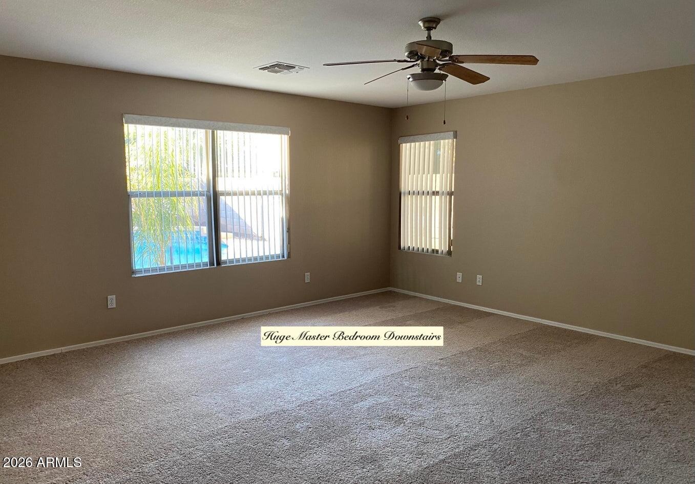 3427 East Derringer Way Gilbert, AZ 85297 - Photo 6 of 23 a view of an empty room with a window