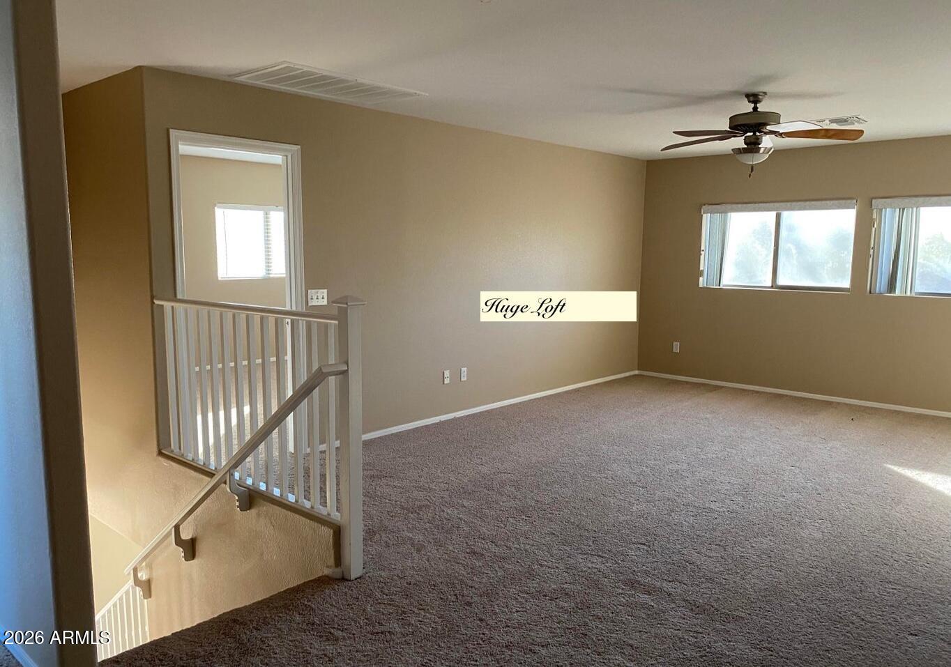 3427 East Derringer Way Gilbert, AZ 85297 - Photo 10 of 23 an empty room with windows