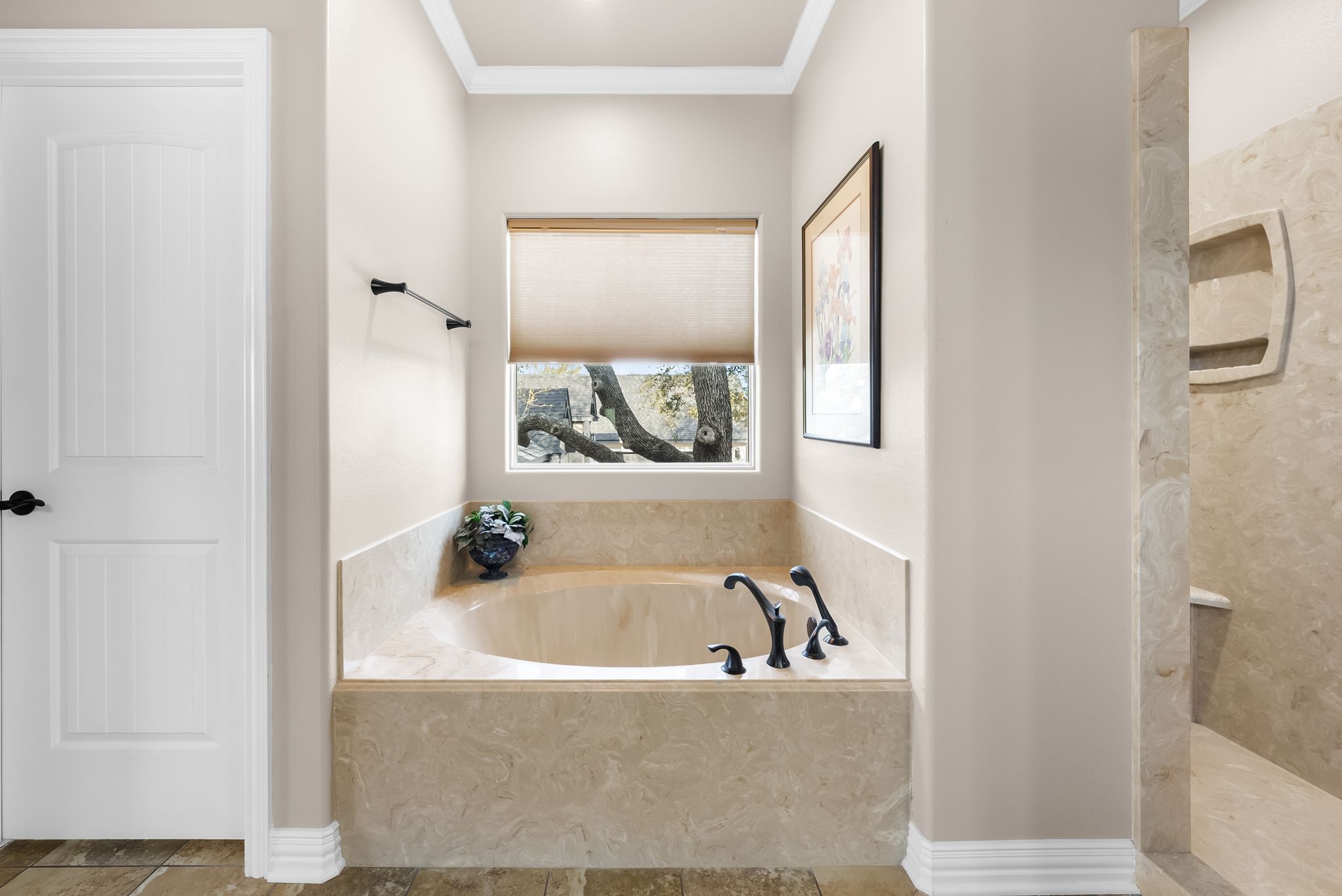 1735 Alta Vista Loop Temple, TX 76502 - Photo 12 of 38 a bathroom with a bathtub and a window