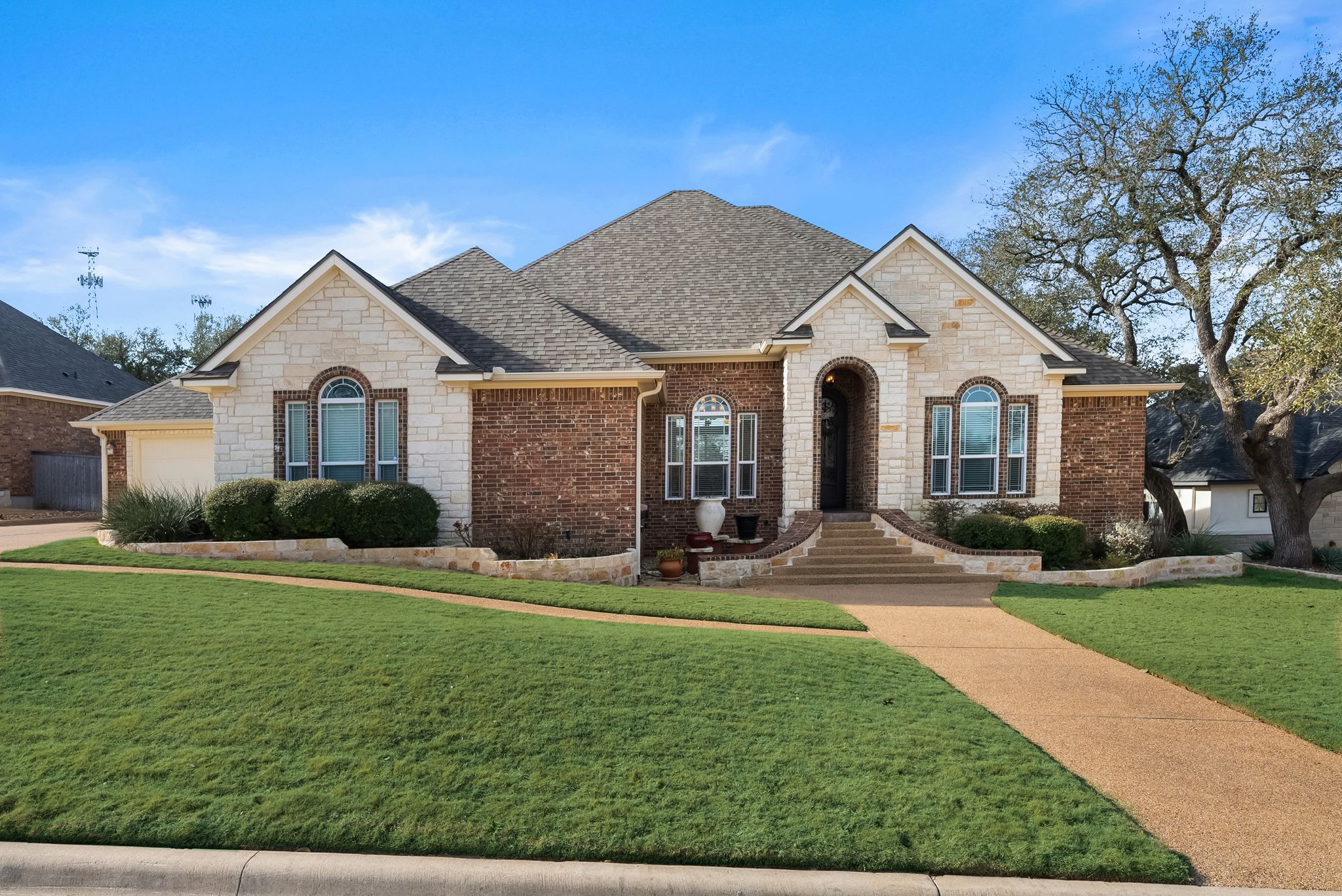 1735 Alta Vista Loop Temple, TX 76502 - Photo 2 of 38 a front view of a house with yard and green space