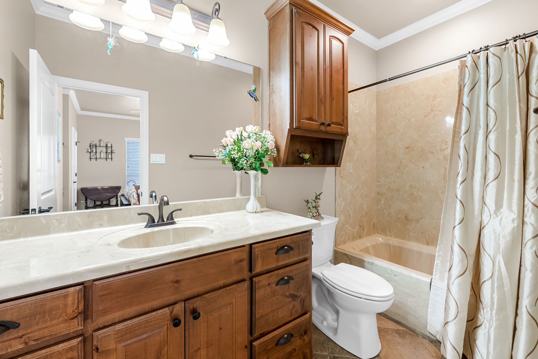 1735 Alta Vista Loop Temple, TX 76502 - Photo 21 of 38 a bathroom with a granite countertop sink a toilet and shower
