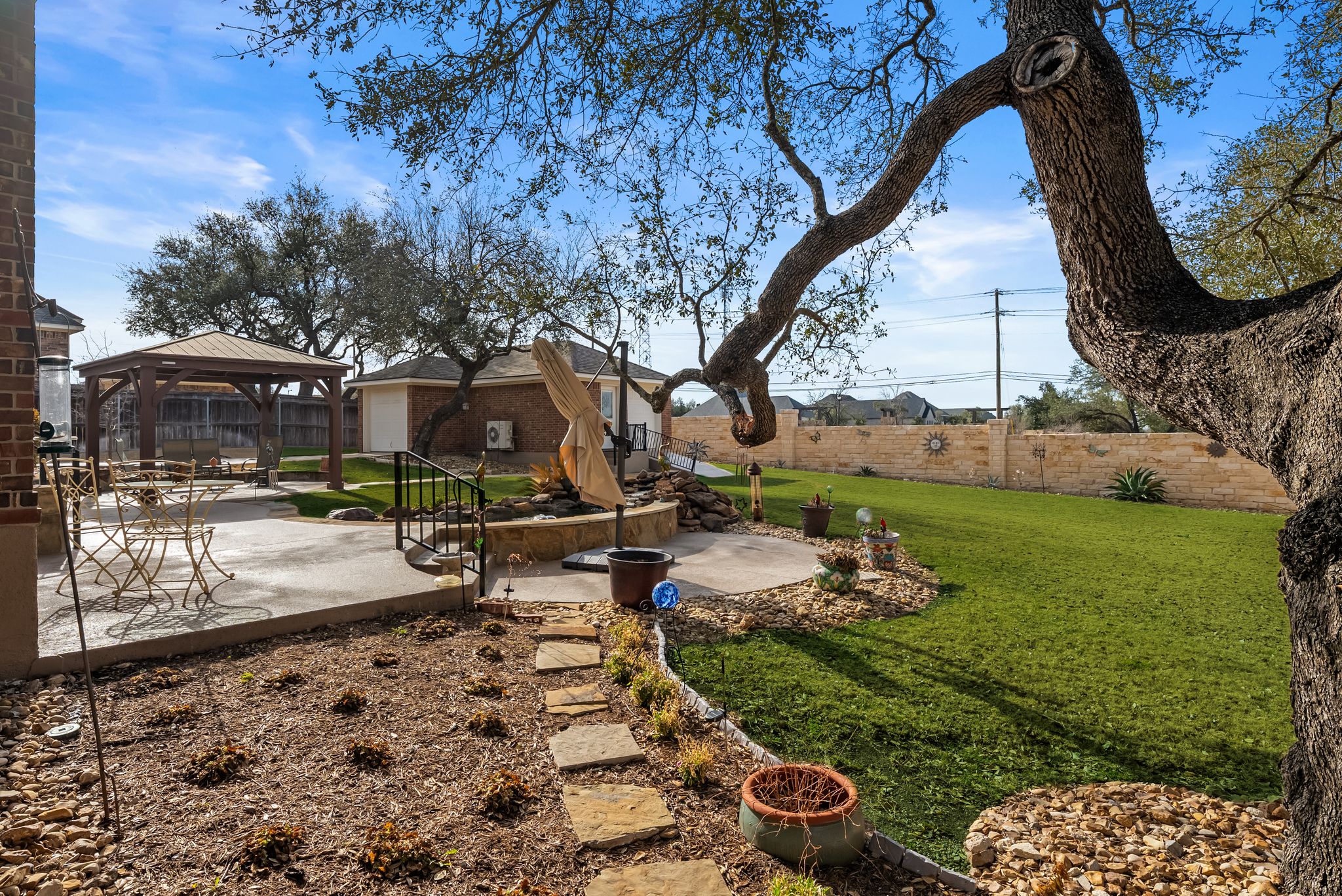1735 Alta Vista Loop Temple, TX 76502 - Photo 35 of 38 a backyard of a house with table and chairs