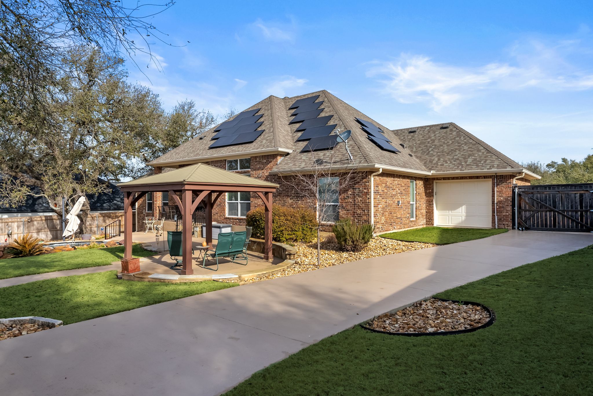 1735 Alta Vista Loop Temple, TX 76502 - Photo 37 of 38 a front view of a house with a garden and trees