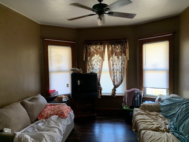5929 West Rice Street Chicago, IL 60651 - Photo 5 of 29 a living room with furniture and a large window