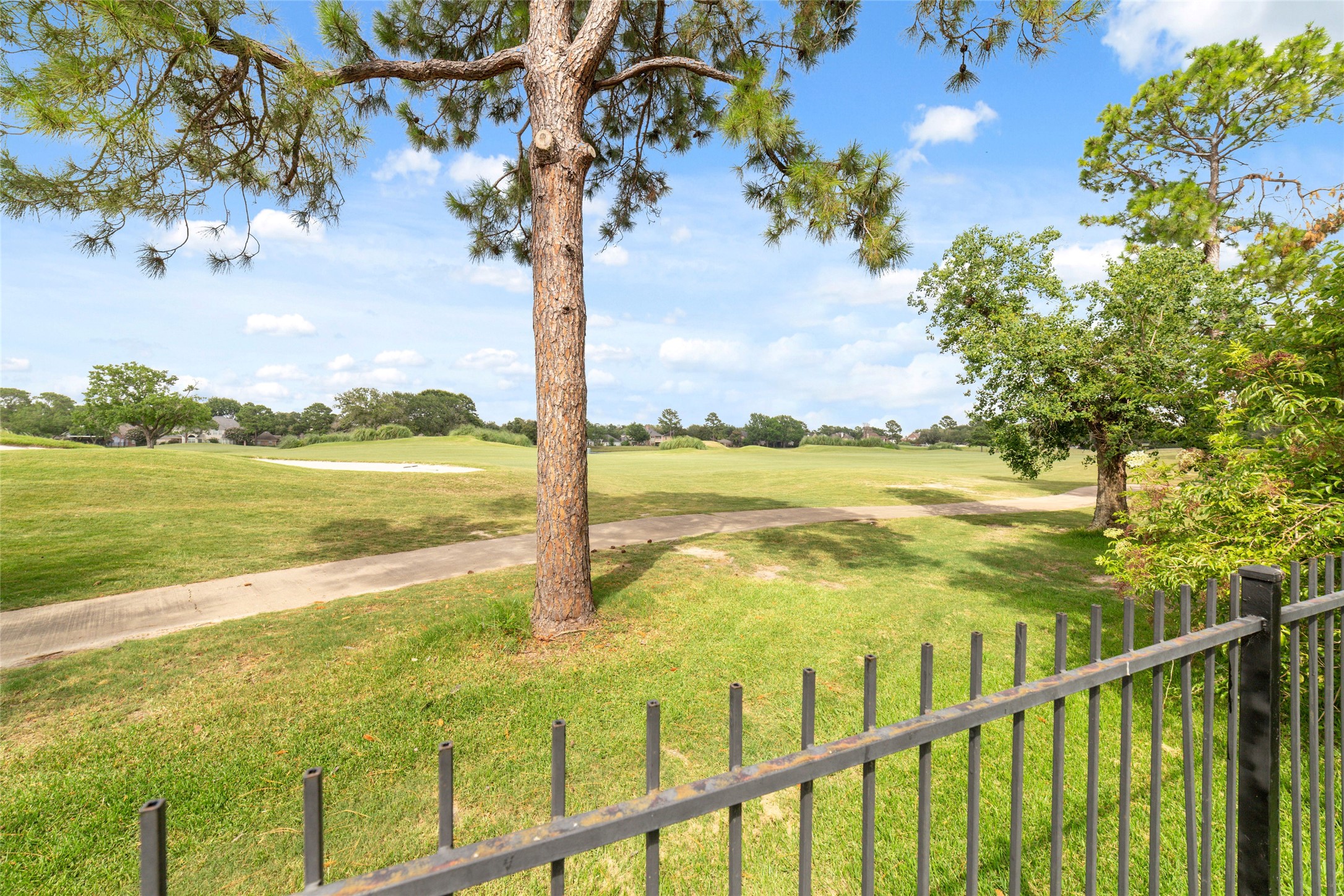 24203 Moon Ridge Court Katy, TX 77494 - Photo 41 of 43 View of the Falcon Point Golf Course from the backyard offering a picturesque and peaceful setting.
