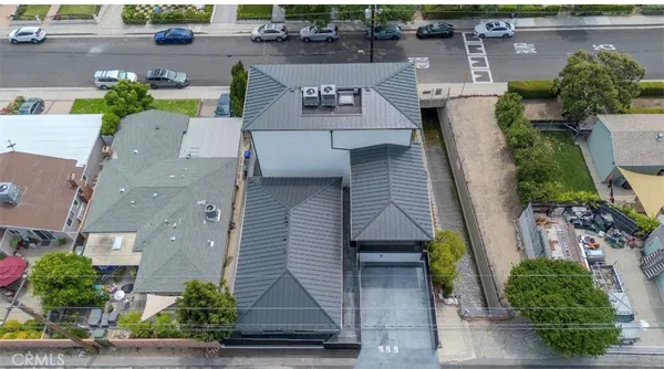 an aerial view of a house with a garden