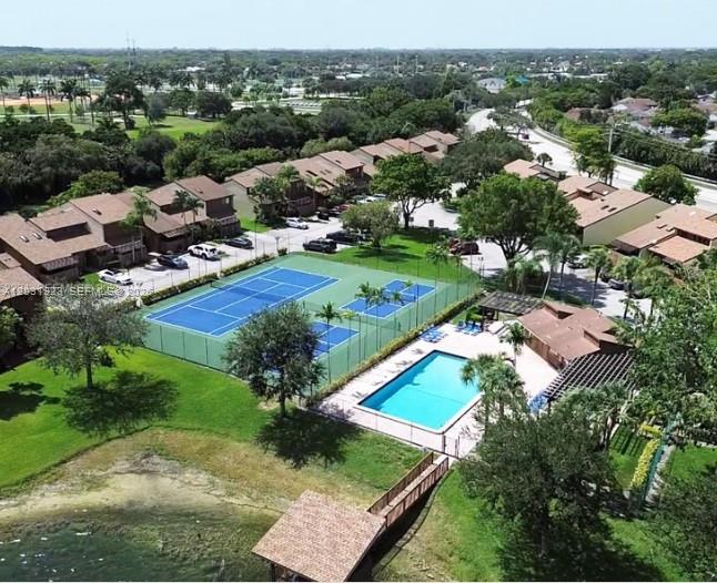 4182 South Pine Island Road Davie, FL 33328 - Photo 6 of 6 an aerial view of a residential houses with outdoor space and river