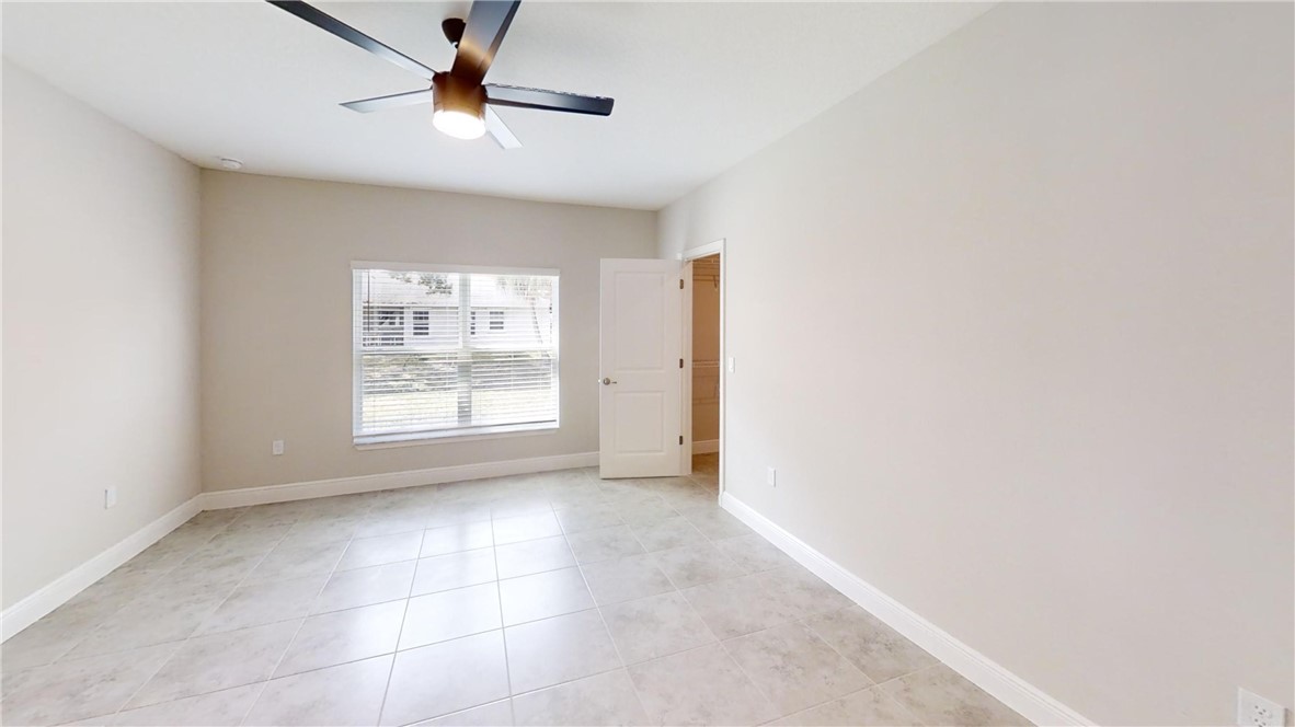 418 Easy Street Sebastian, FL 32958 - Photo 14 of 34 a view of an empty room with a window