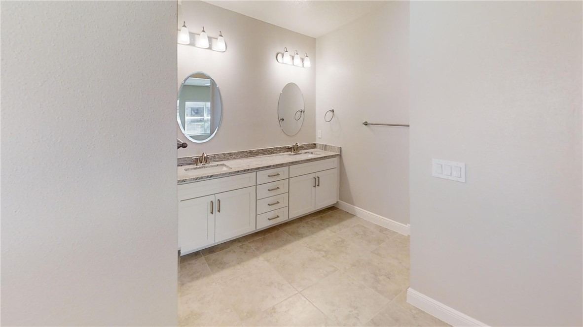 418 Easy Street Sebastian, FL 32958 - Photo 17 of 34 a view of a bathroom with mirror and sink