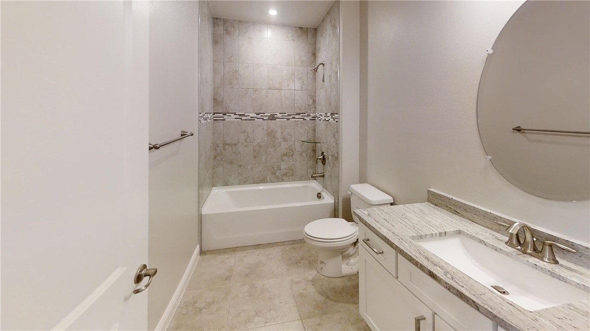 418 Easy Street Sebastian, FL 32958 - Photo 23 of 34 a bathroom with a granite countertop sink toilet and shower