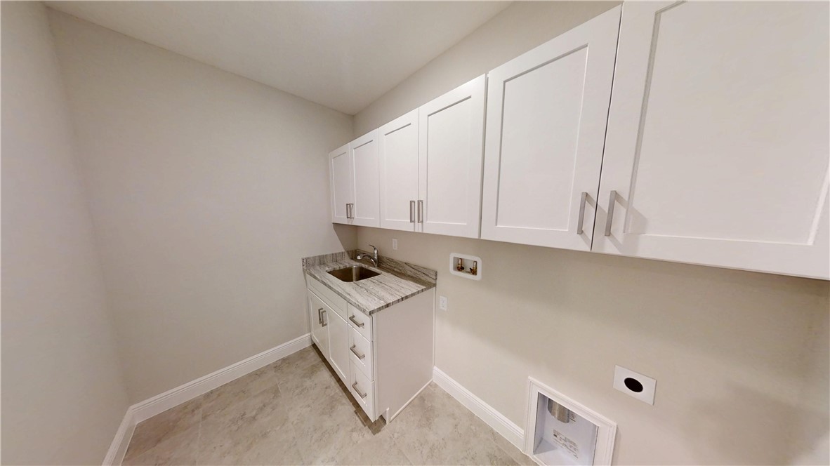 418 Easy Street Sebastian, FL 32958 - Photo 25 of 34 a room with cabinets and white walls