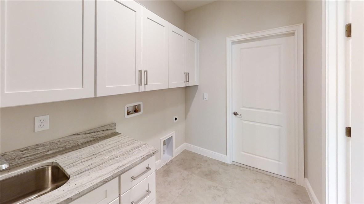418 Easy Street Sebastian, FL 32958 - Photo 26 of 34 a kitchen with granite countertop white cabinets and stainless steel appliances