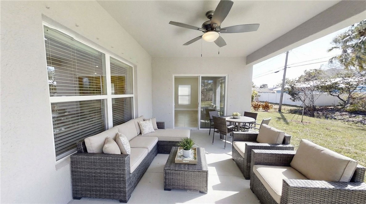 418 Easy Street Sebastian, FL 32958 - Photo 30 of 34 a living room with furniture and a large window