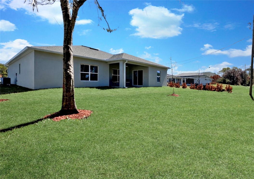 418 Easy Street Sebastian, FL 32958 - Photo 32 of 34 a view of a yard in front of house