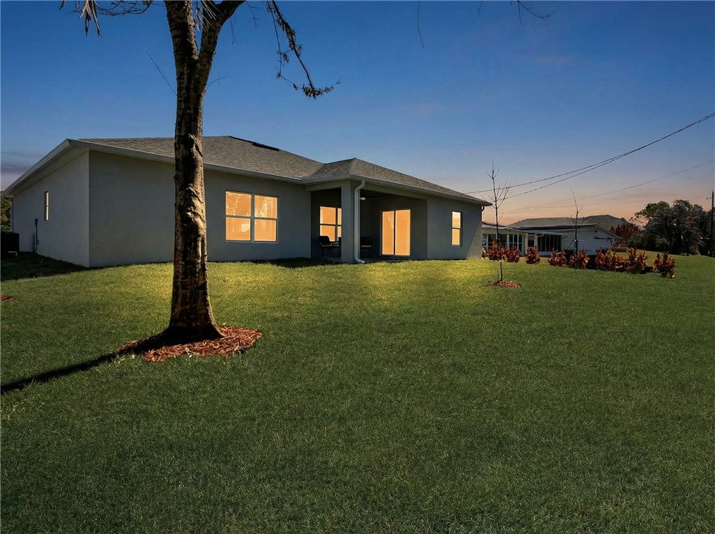 418 Easy Street Sebastian, FL 32958 - Photo 34 of 34 a front view of a house with a yard