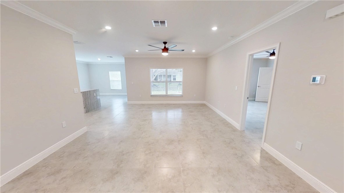 418 Easy Street Sebastian, FL 32958 - Photo 4 of 34 wooden floor in an empty room with a window