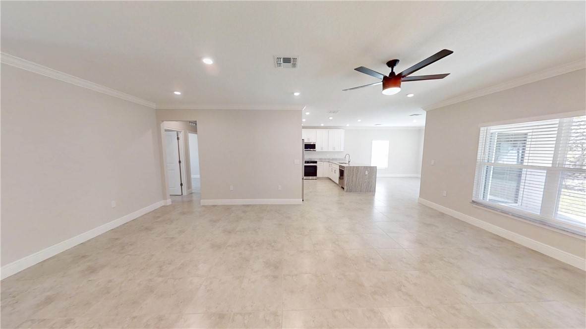 418 Easy Street Sebastian, FL 32958 - Photo 6 of 34 a view of an empty room with a window