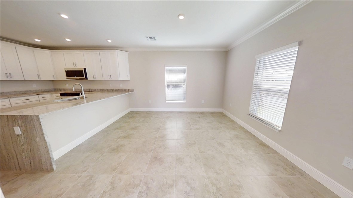 418 Easy Street Sebastian, FL 32958 - Photo 10 of 34 a view of a kitchen with a sink cabinets and a window