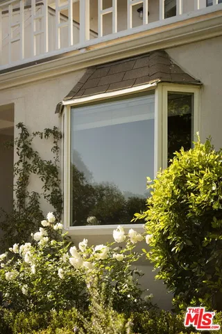 a view of a house with a tree