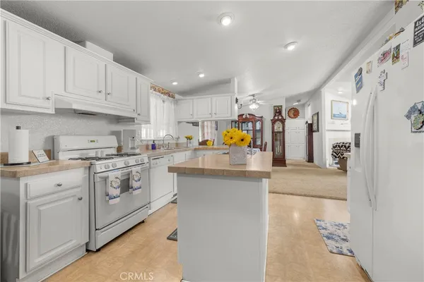 a kitchen with cabinets and stainless steel appliances