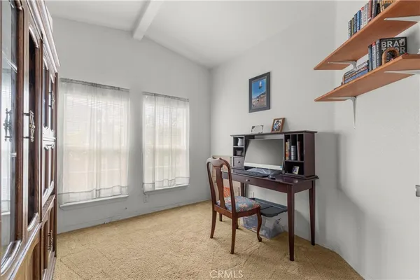 a workspace with furniture and window