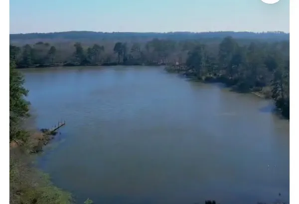 a view of a lake in front of lake and residential houses