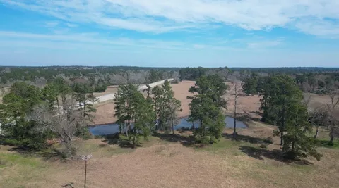 an aerial view of residential house and outdoor space