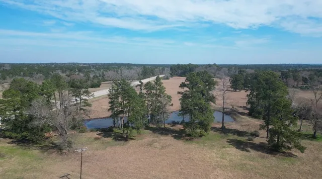 an aerial view of residential house and outdoor space