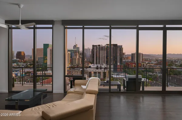 a view of a balcony with furniture