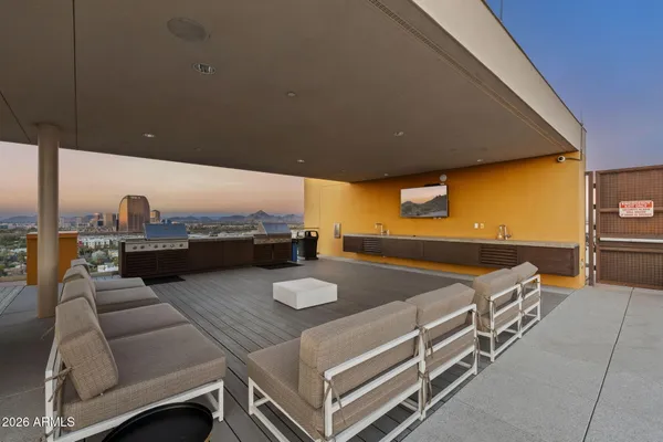 a view of a swimming pool with a house in patio