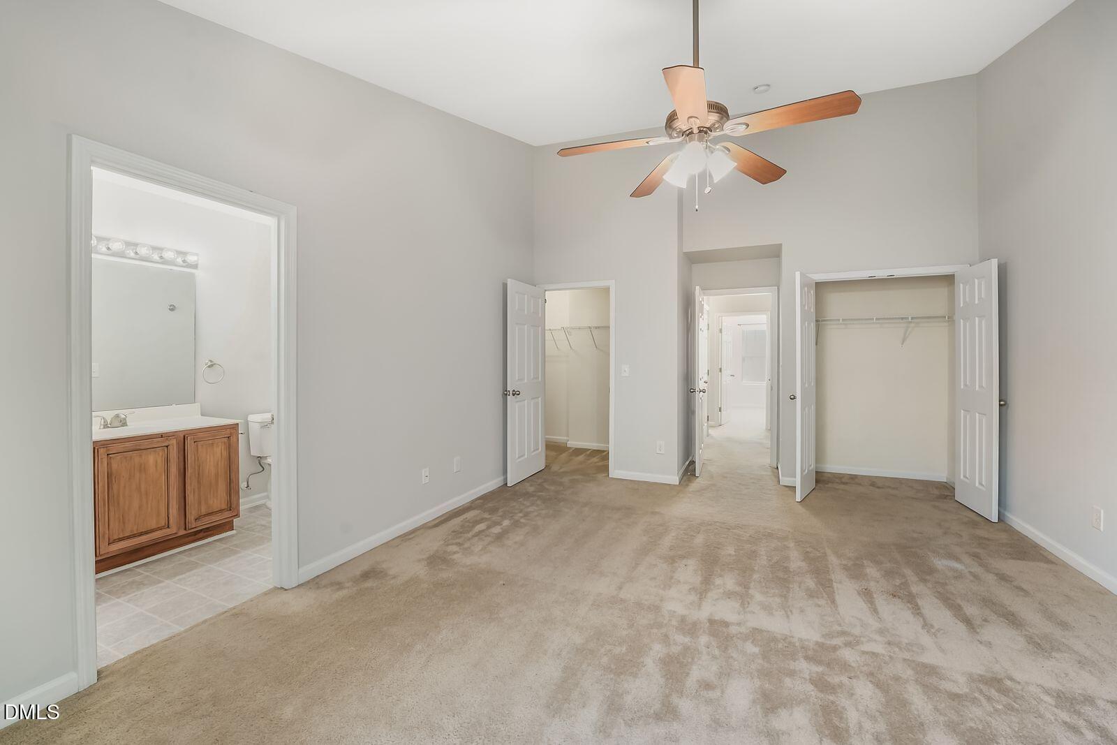 4909 Blue Rock Court Raleigh, NC 27610 - Photo 12 of 15 a view of an empty room with a ceiling fan and window