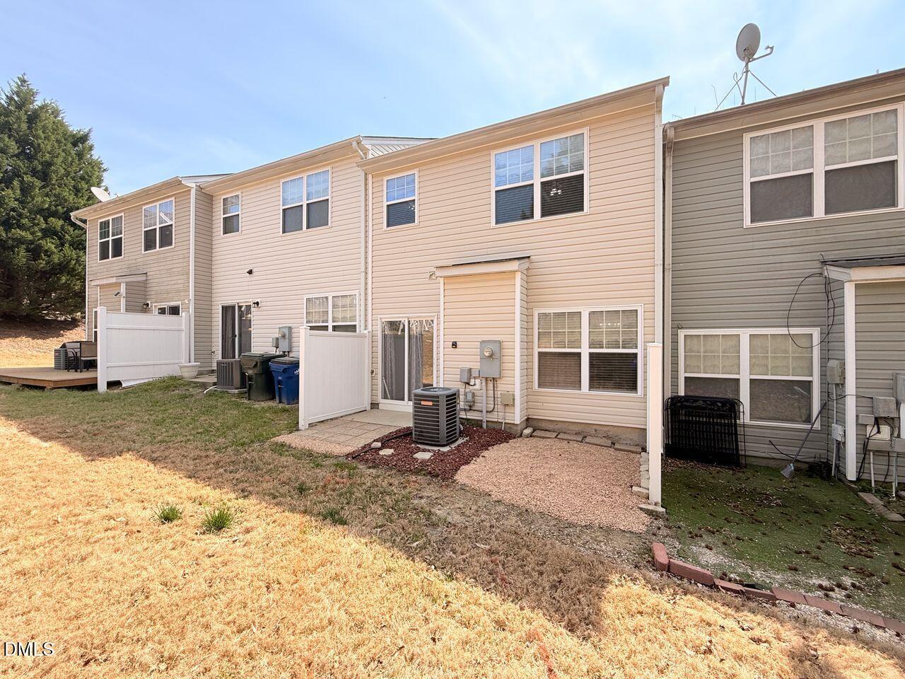 4909 Blue Rock Court Raleigh, NC 27610 - Photo 2 of 15 a view of a backyard with wooden fence and a refrigerator