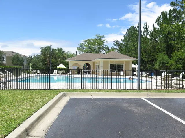 a view of a house with a backyard and porch