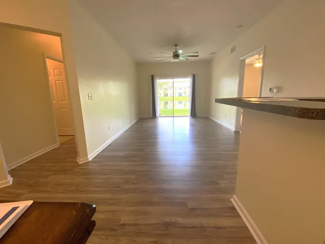 a view of a livingroom with wooden floor