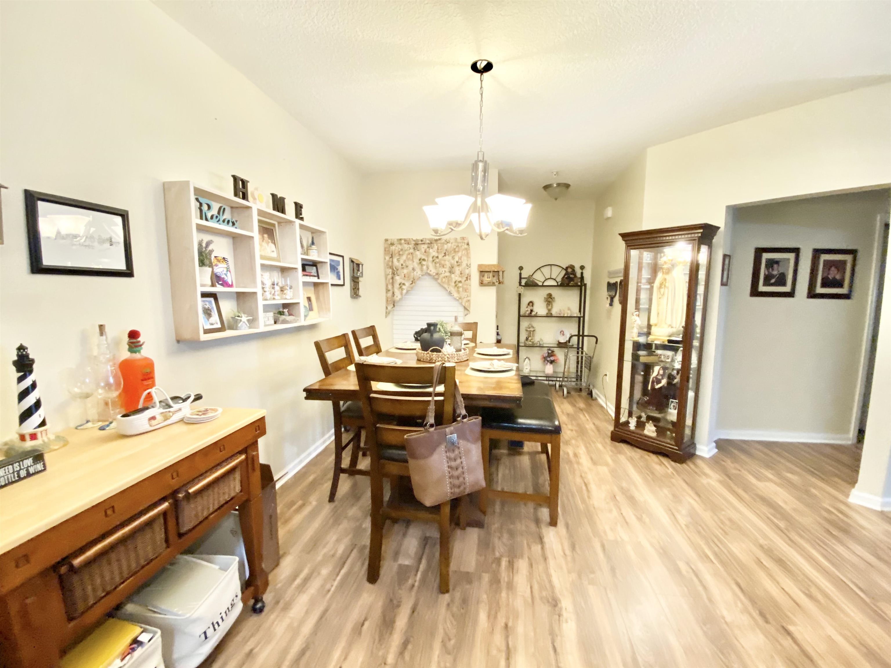 2534 Golden Lake Loop St. Augustine, FL 32084 - Photo 10 of 16 a view of a dining room with furniture window and wooden floor