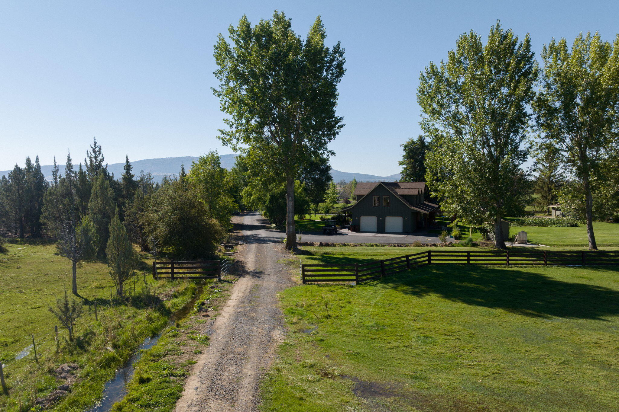 11311 Fleming Road Powell Butte, OR 97753 - Photo 11 of 58 gravel road into hay field
