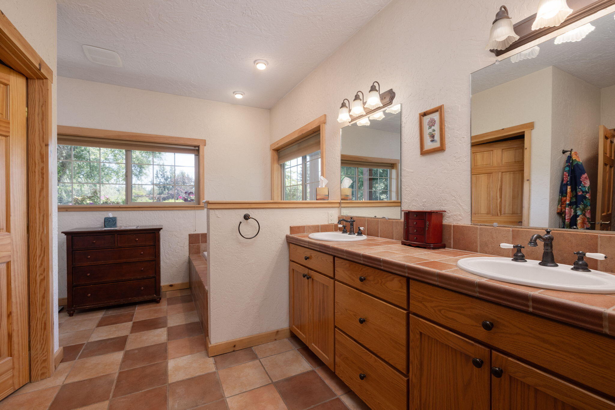 11311 Fleming Road Powell Butte, OR 97753 - Photo 25 of 58 primary suite bath, double vanity, tile flooring & counters