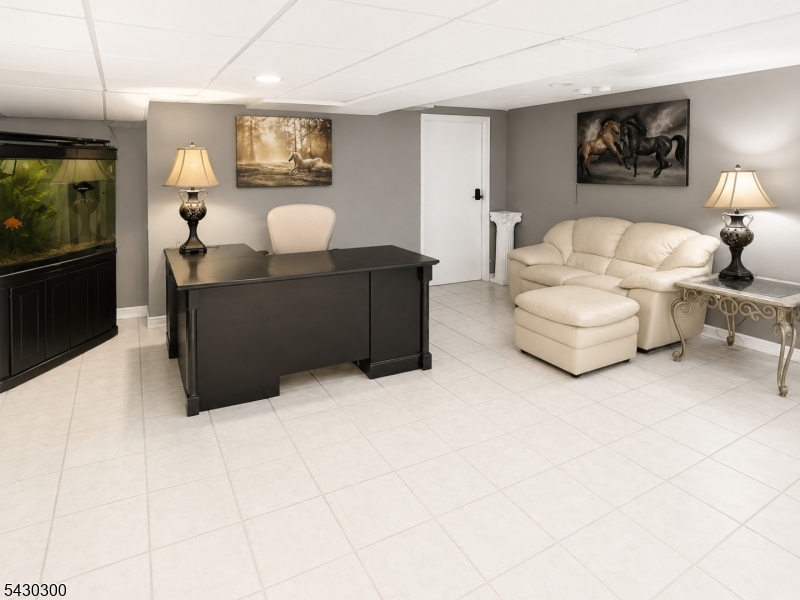 25 Spring Street, Unit A Millburn, NJ 07041 - Photo 15 of 21 a living room with furniture