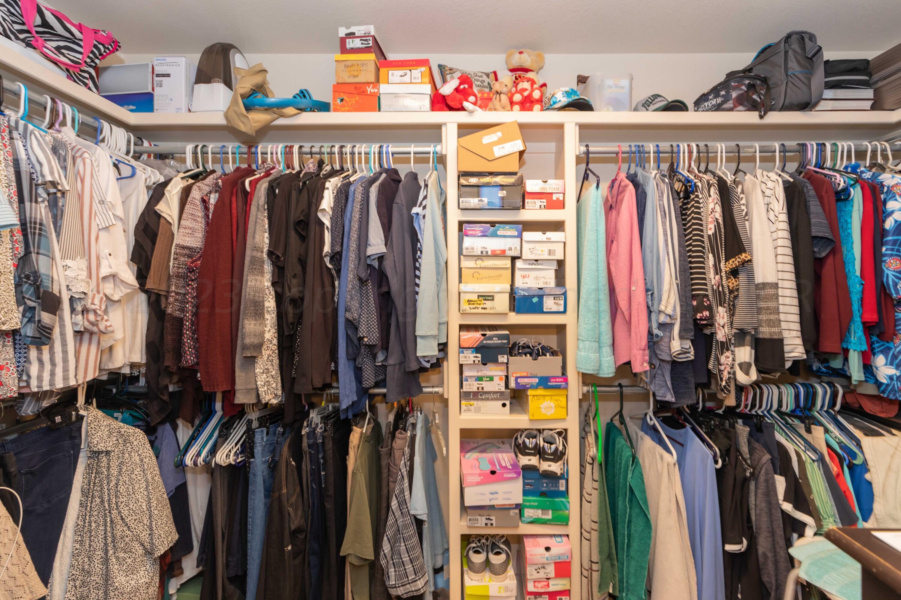 5904 South Rusk Street Amarillo, TX 79118 - Photo 23 of 49 a view of walk in closet with clothes