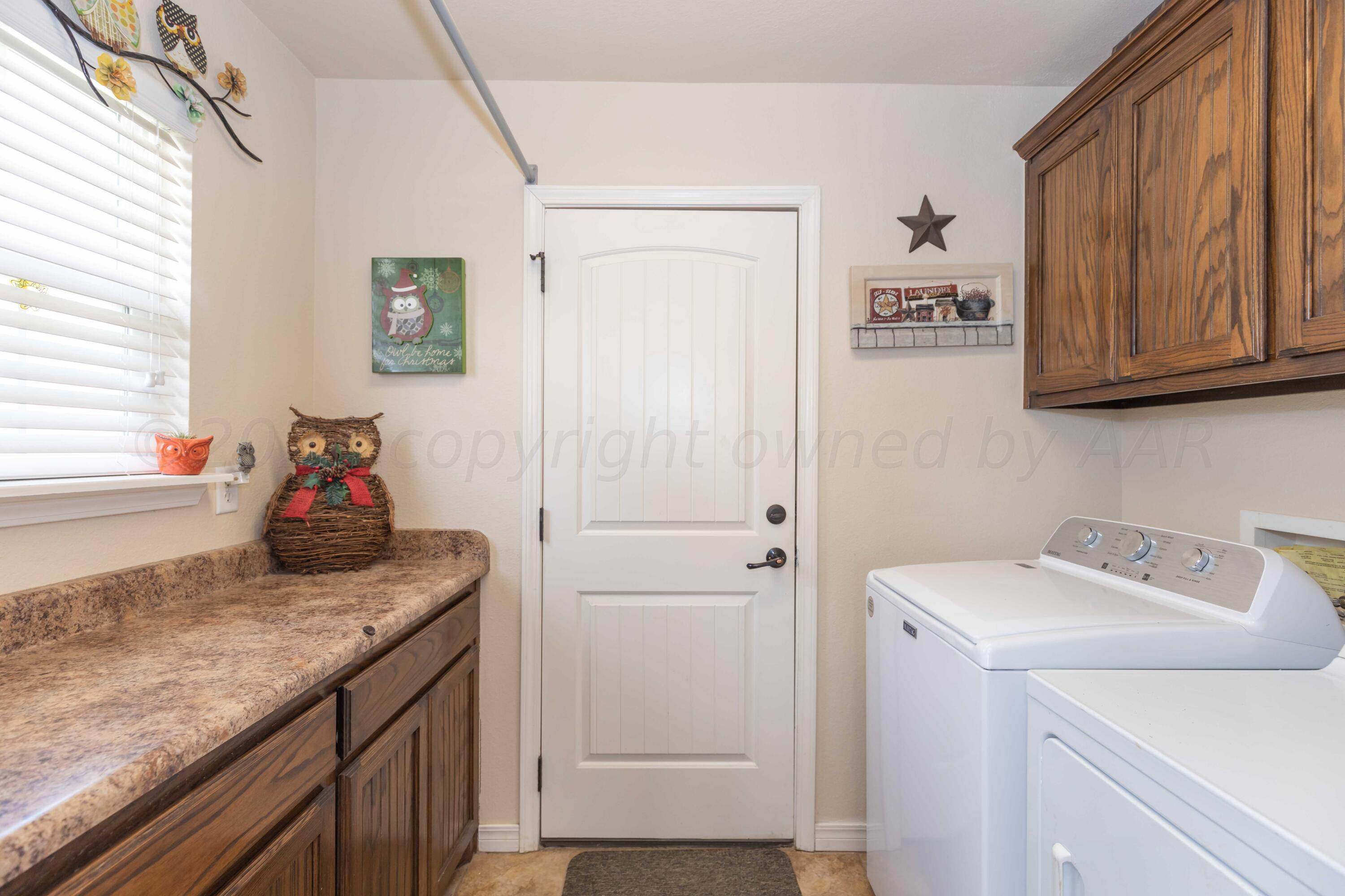 5904 South Rusk Street Amarillo, TX 79118 - Photo 40 of 49 a utility room with washer and dryer