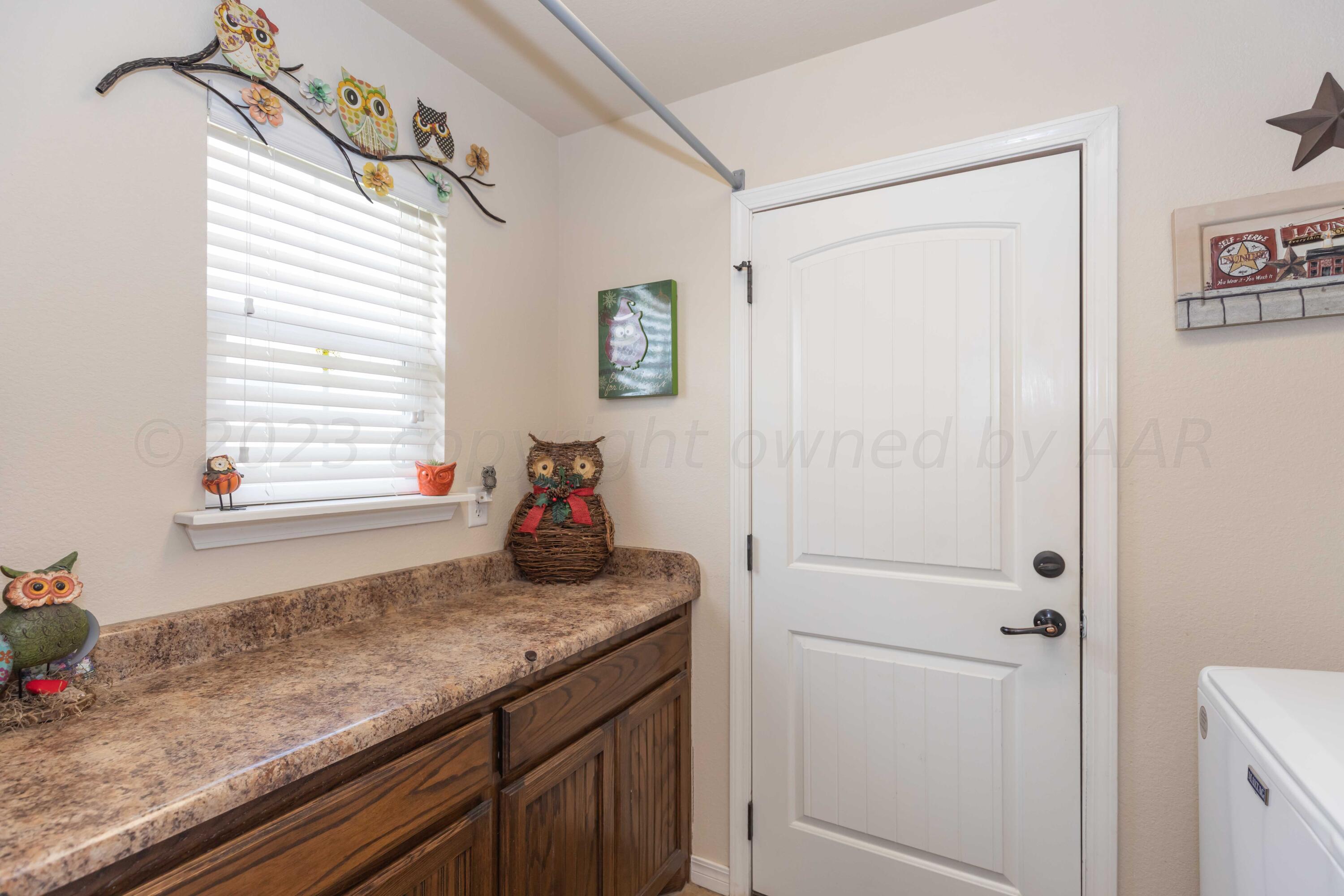 5904 South Rusk Street Amarillo, TX 79118 - Photo 41 of 49 a bathroom with a granite countertop sink and a mirror