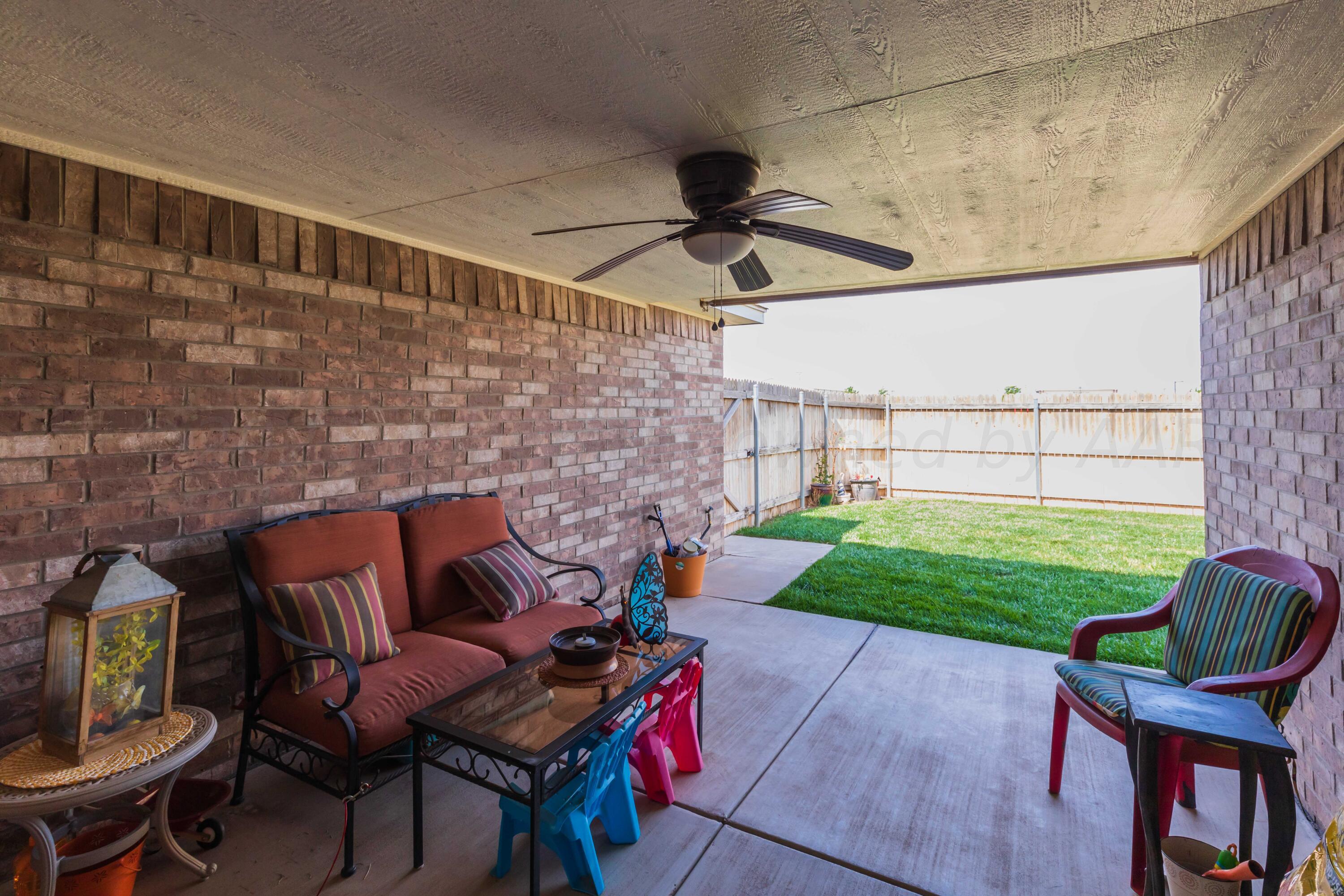5904 South Rusk Street Amarillo, TX 79118 - Photo 43 of 49 a outdoor living space with furniture and a garden