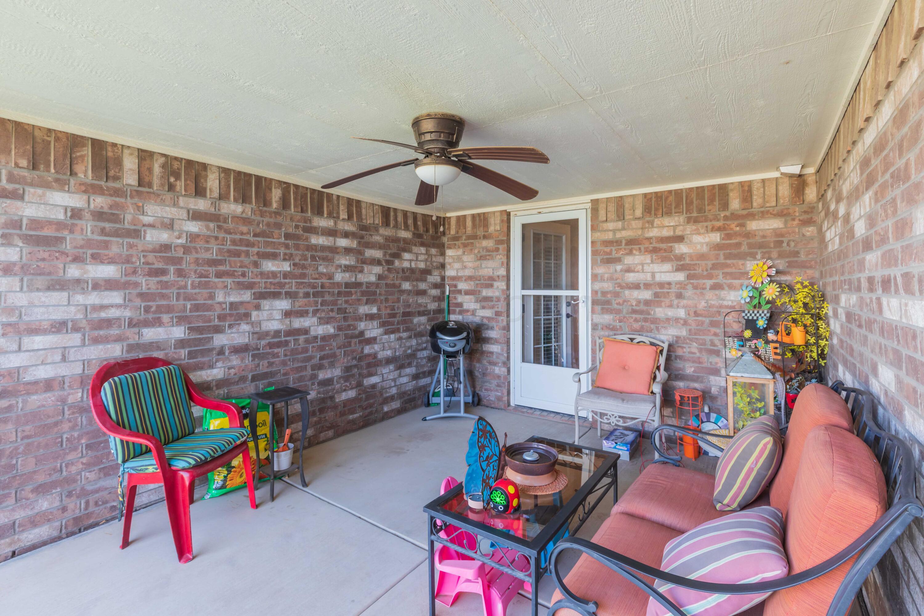 5904 South Rusk Street Amarillo, TX 79118 - Photo 44 of 49 a living room with furniture and a table