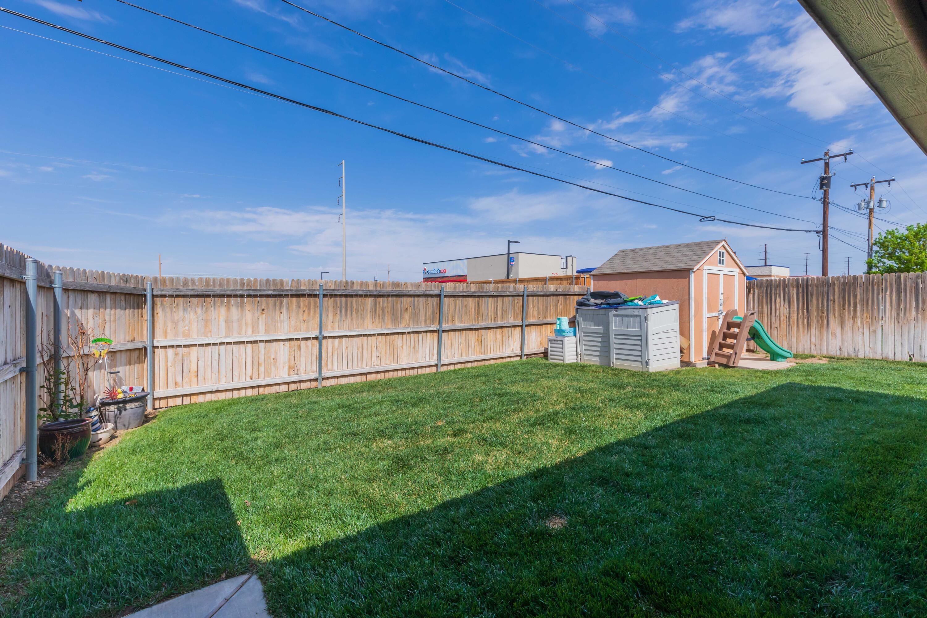 5904 South Rusk Street Amarillo, TX 79118 - Photo 46 of 49 a view of a backyard with wooden fence