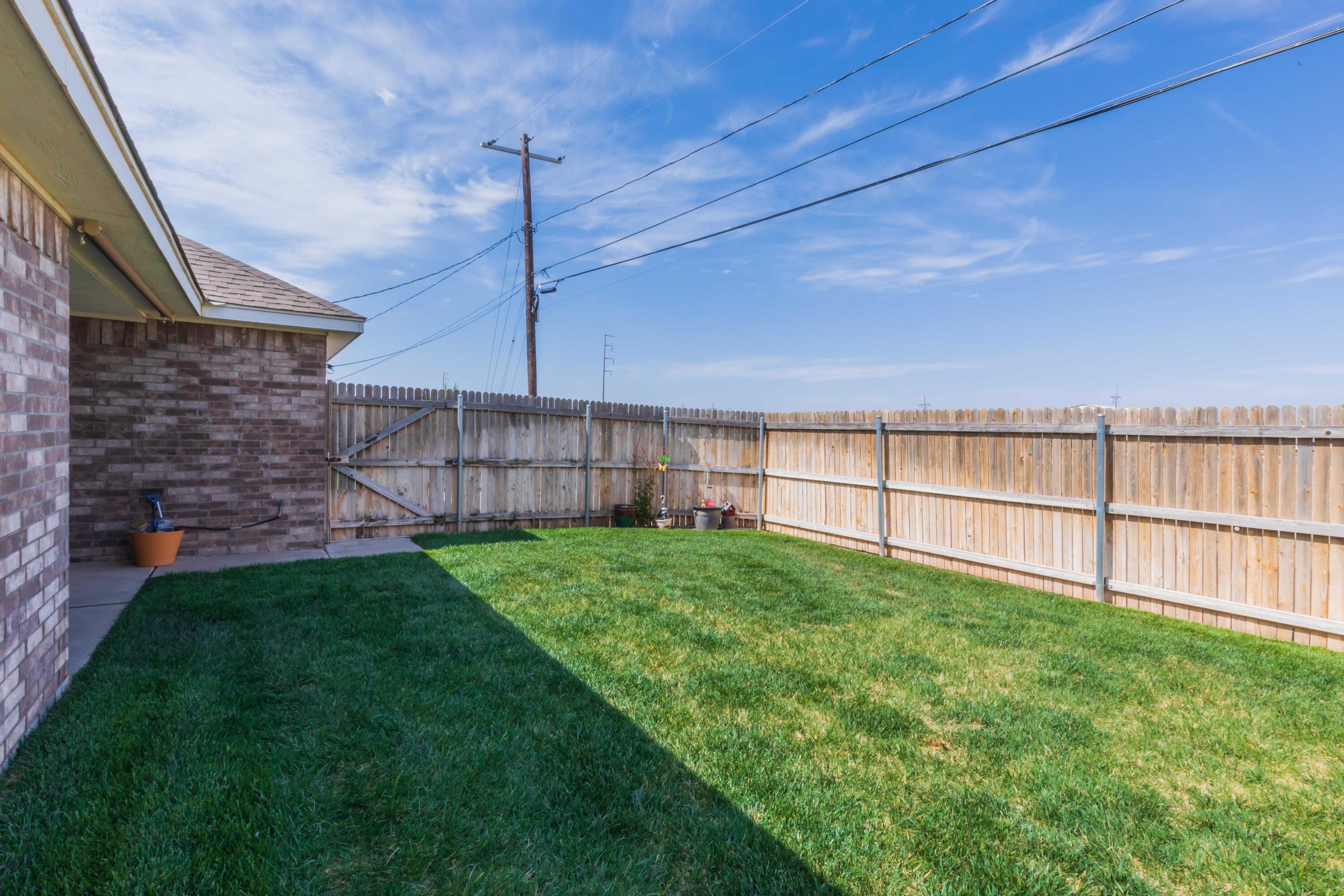 5904 South Rusk Street Amarillo, TX 79118 - Photo 47 of 49 a view of a backyard with ceiling fan