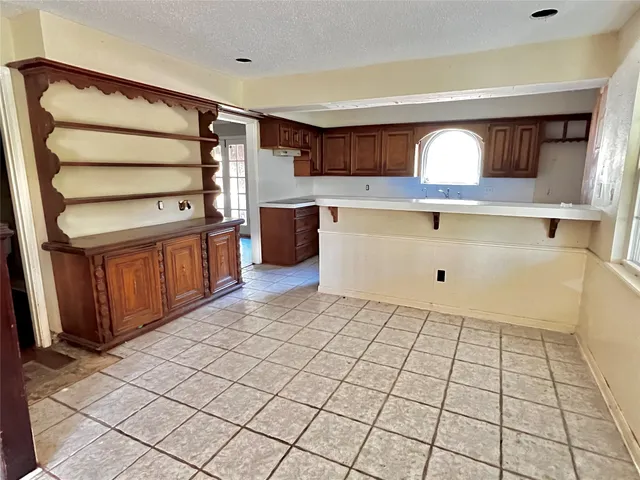 a view of kitchen with furniture and window